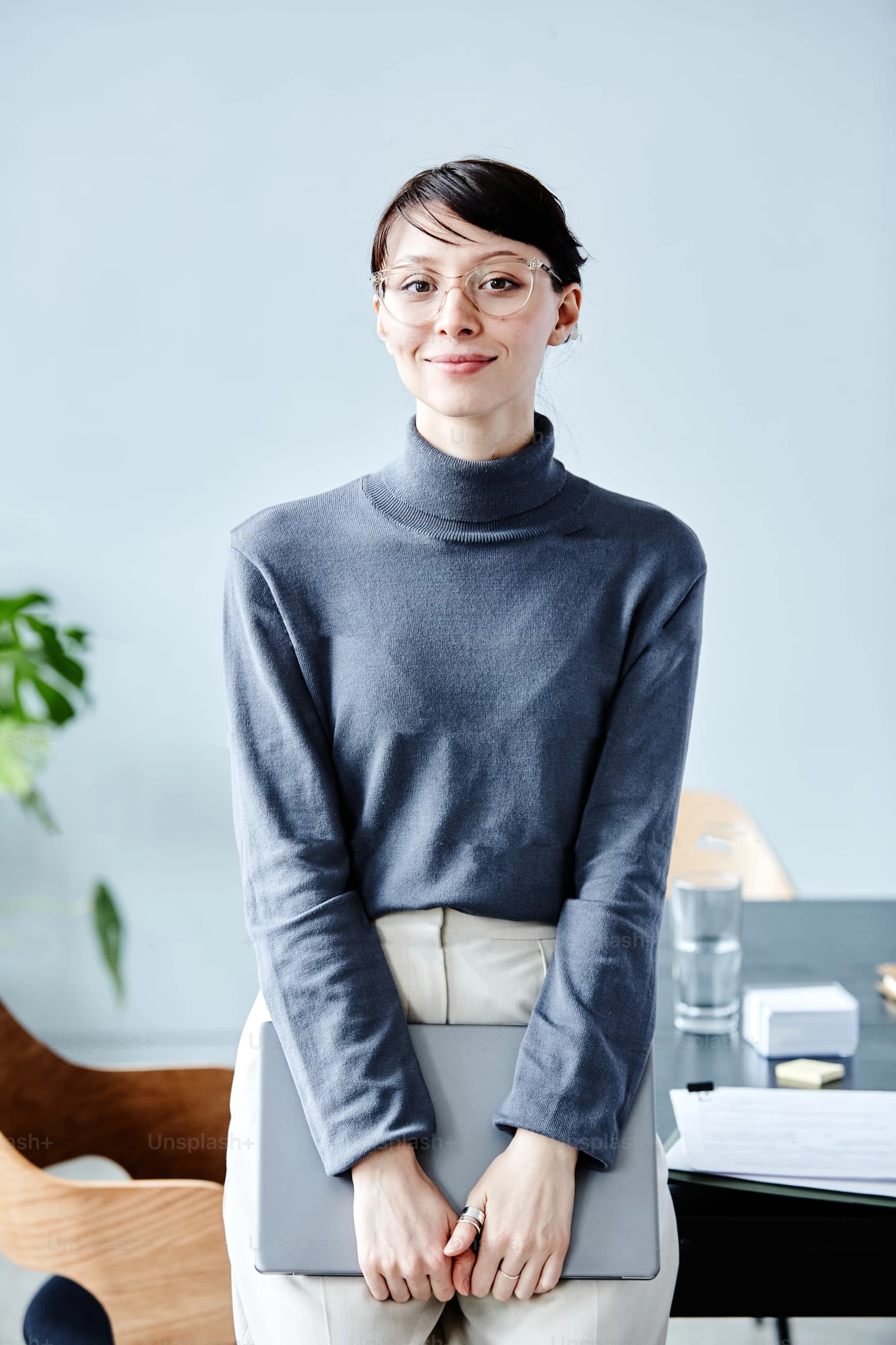 Portrait of a person in a bright office.