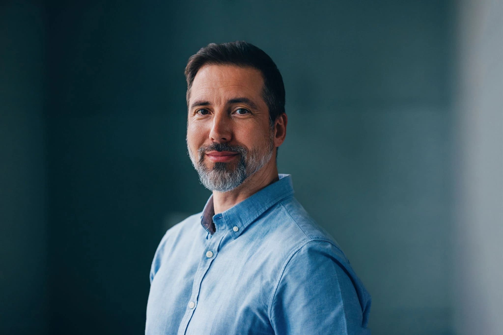 Portrait of a person wearing a blue shirt.