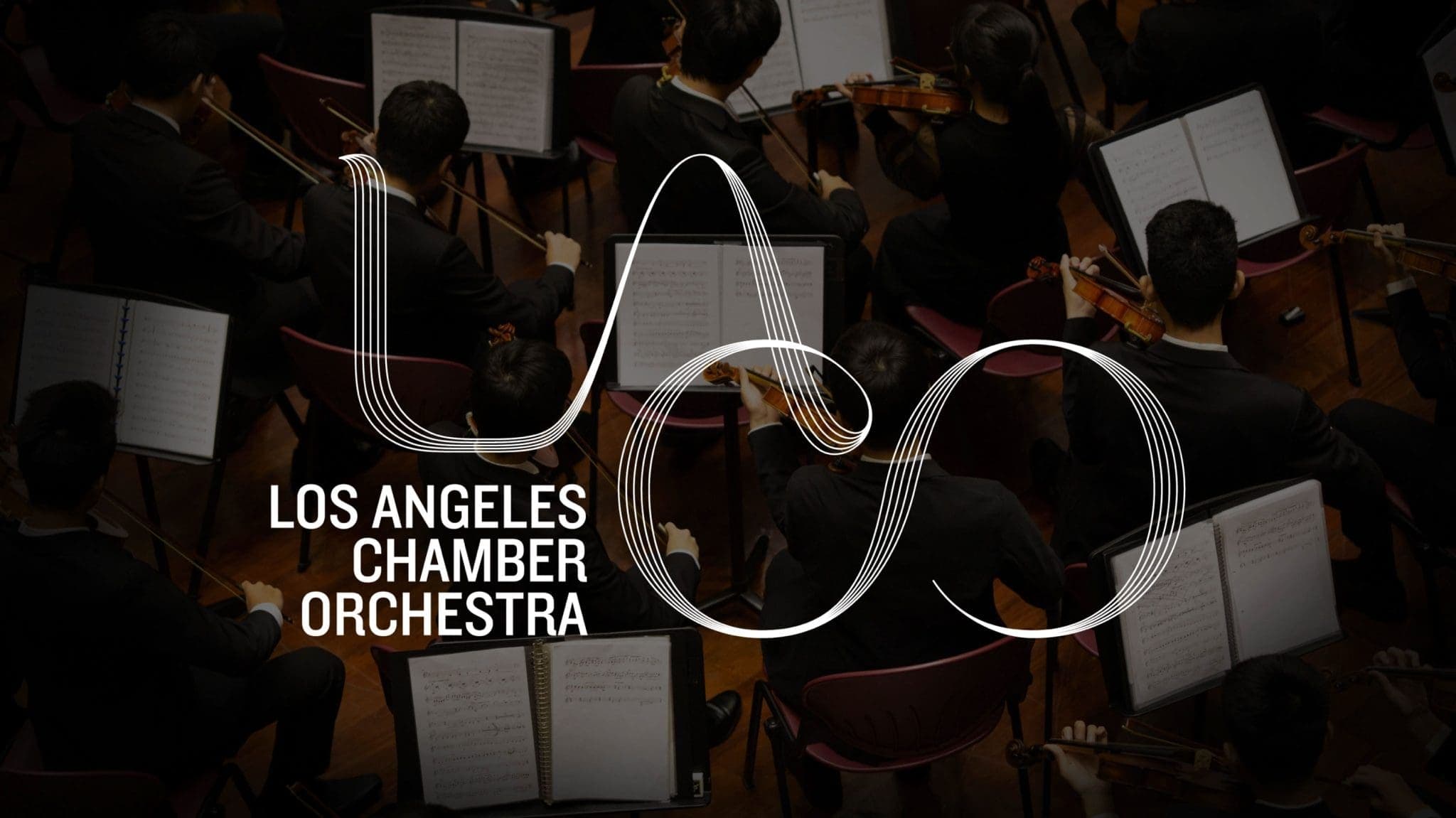 LACO line-drawn logo over an orchestra photograph