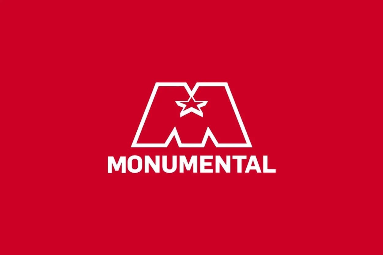 White Monumental logo on a red background